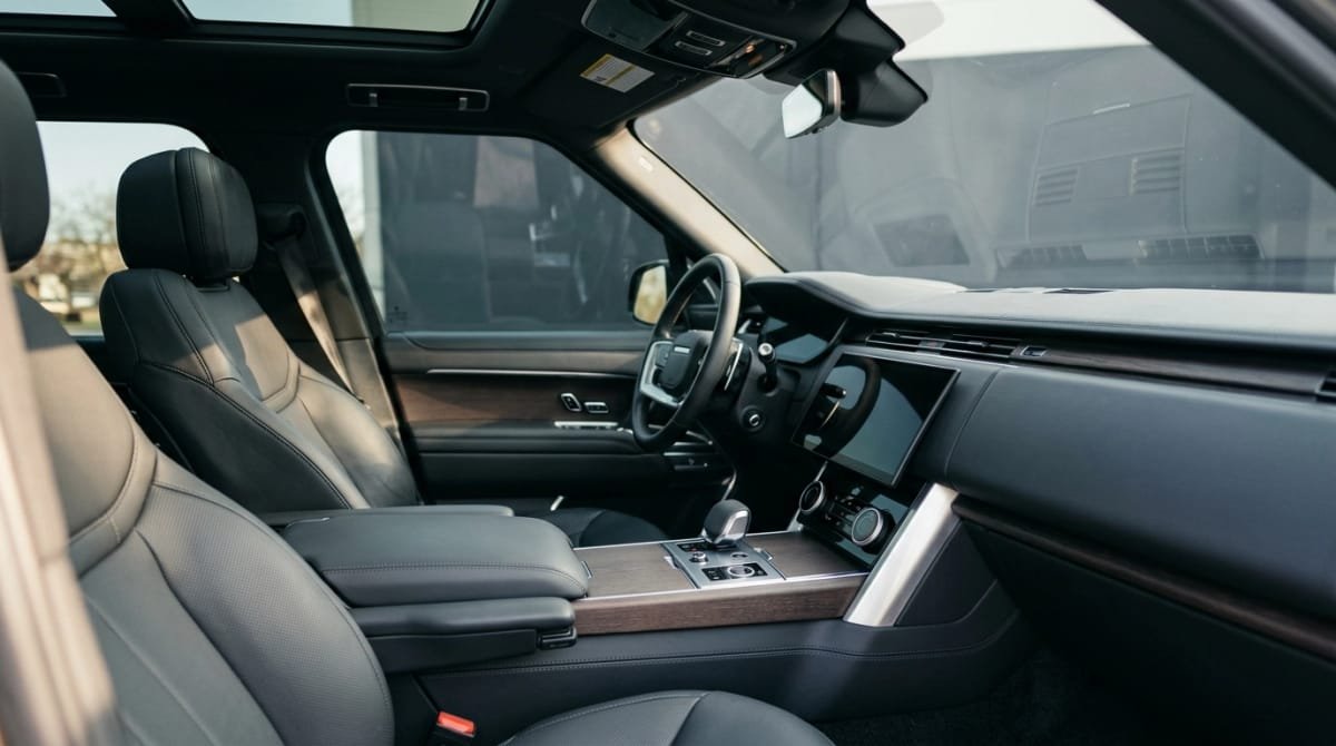 Premium vehicle interior with sunlight filtered through professionally tinted windows