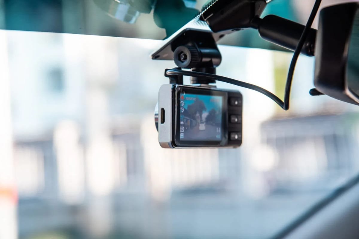 A high-definition dash cam professionally installed on a windshield with hidden wiring for a clean, factory look.